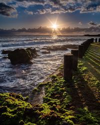 Scenic view of sea against sky during sunset