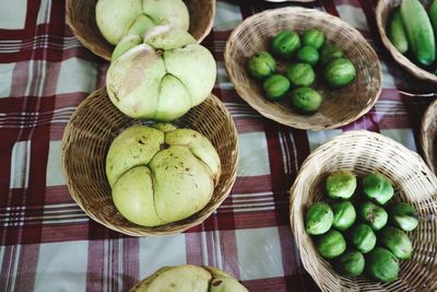 High angle view of fruits in basket on table