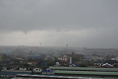 High angle view of buildings in city against sky