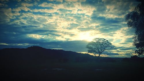 Scenic view of landscape against cloudy sky