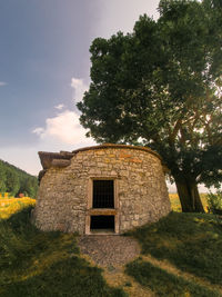 House on field against sky