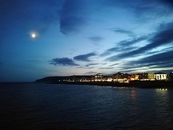 Scenic view of sea against sky at night