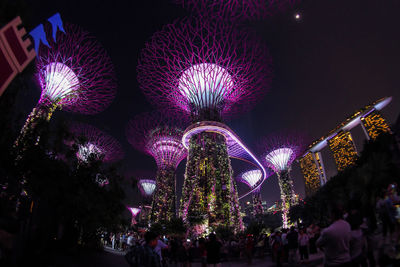 Low angle view of illuminated fireworks at night