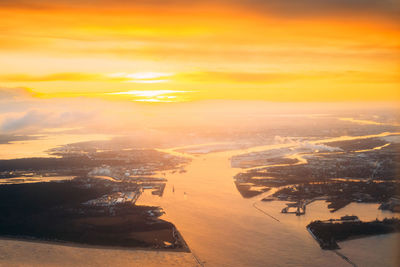 Aerial view of city at sunset