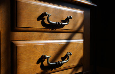 A chest of drawers in a sunlit room