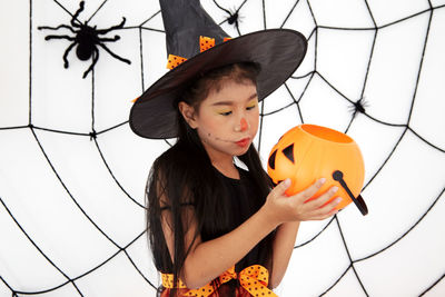 Portrait of girl holding ice cream during halloween
