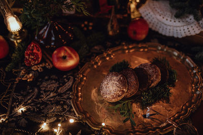 Christmas academia vintage harry potter table - fir, candles, wine, red decor, glasses, gingerbread