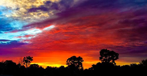 Low angle view of cloudy sky at sunset