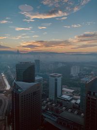 High angle view of buildings against sky during sunset