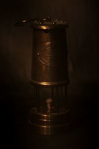 Close-up of electric lamp over black background