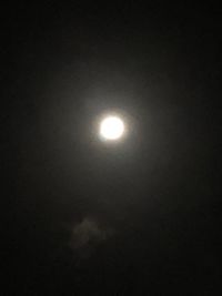 Low angle view of moon in sky at night