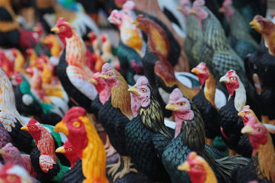 Full frame shot of rooster statues at market stall