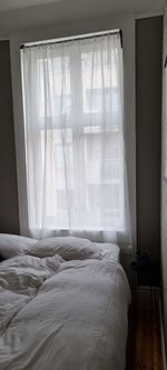 White curtain on bed at home