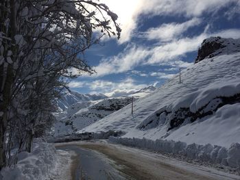 Scenic view of snow covered landscape against sky