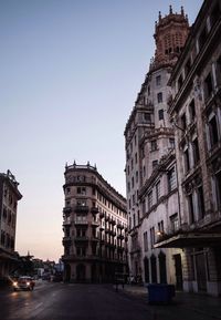 Low angle view of buildings against clear sky