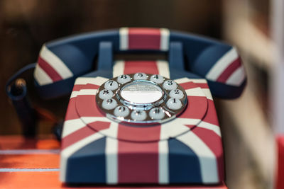 Close-up of british retro telephone on table