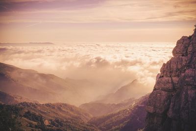 Scenic view of mountains against sky during sunset