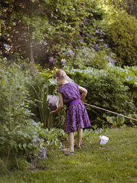 Girl with bag net in garden