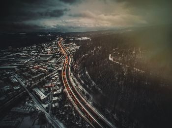 Aerial view of illuminated city at night