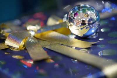 Close-up of christmas decoration on glass table