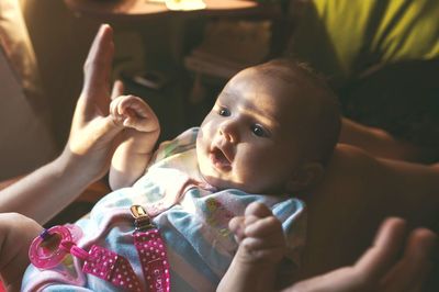 Midsection of father with daughter at home