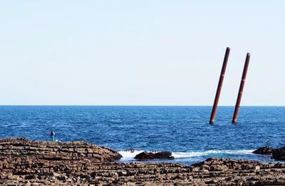 Scenic view of sea against clear sky