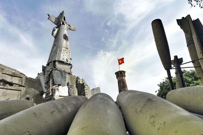 Low angle view of statue against cloudy sky