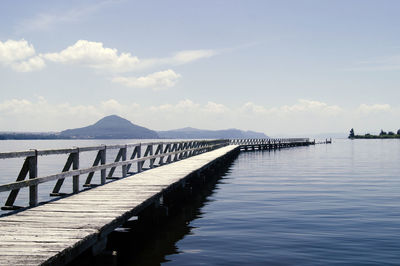 Pier over sea against sky