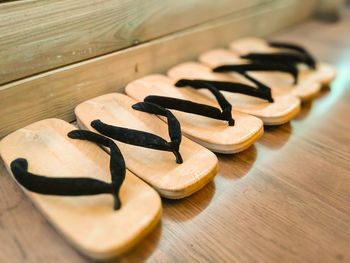 High angle view of japanese wooden clogs on floor