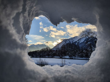 Scenic view of snowcapped mountains against sky