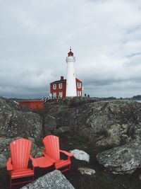 Red lighthouse against sky