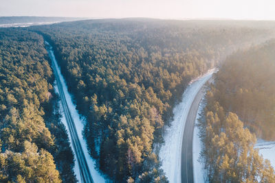 High angle view of river amidst trees against sky
