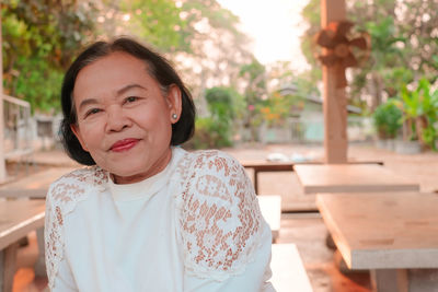 Portrait of smiling woman outdoors