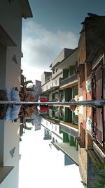 Reflection of buildings on water in city
