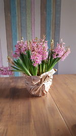 Close-up of flower vase on table at home