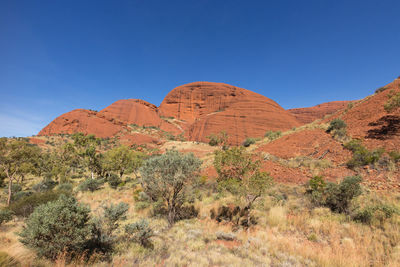 Scenic view of mountains against clear blue sky