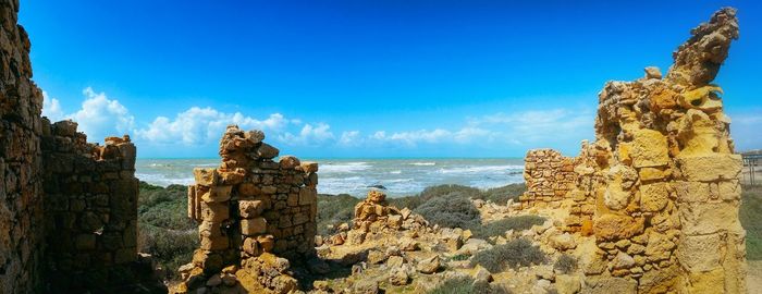 Scenic view of sea against blue sky