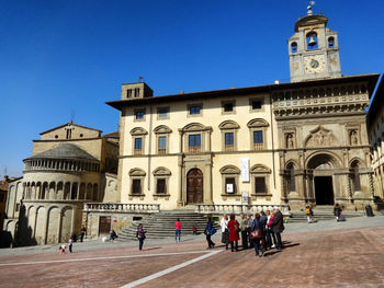 Low angle view of historical building against clear blue sky