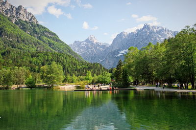 Scenic view of jasna lake with slovenian alps in background