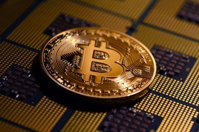 Close-up of bitcoin on computer circuit board