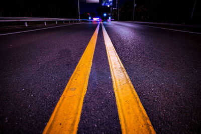 Surface level of yellow road marking on highway at night
