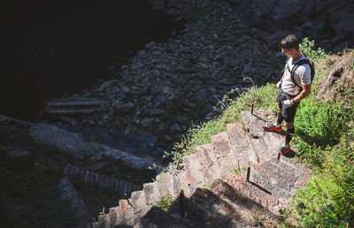 High angle view of man standing on rock