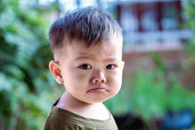 Close up of asian child boy's face with tears. upset crying and mad little toddler boy. 