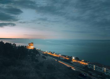 High angle view of road by sea against sky