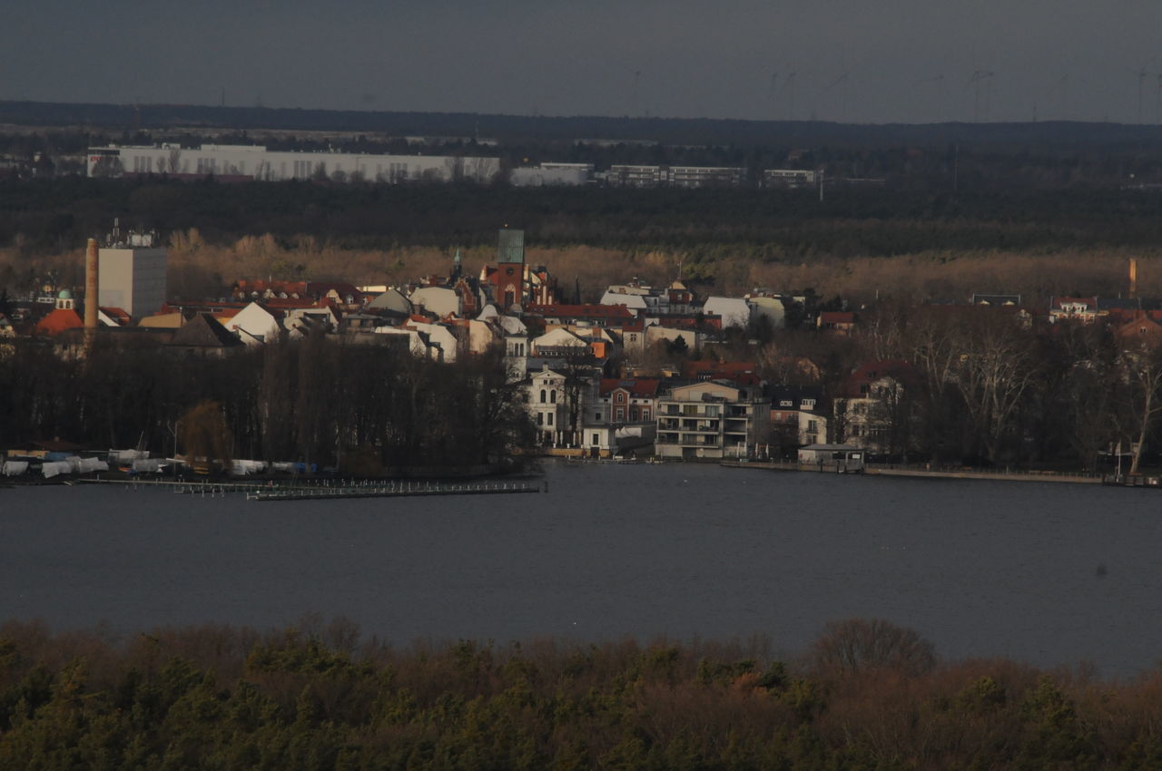 BUILDINGS AND SEA AGAINST SKY