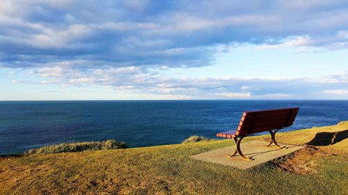 Scenic view of sea against cloudy sky