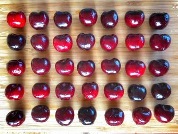 High angle view of multi colored candies on wooden table