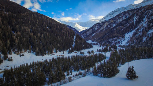 Scenic view of snowcapped mountains against sky during winter