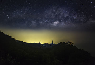 Scenic view of mountains against sky at night