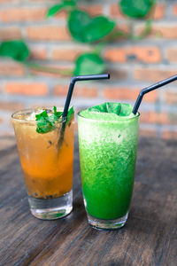 Green and orange fresh smoothies. detox summer drinks